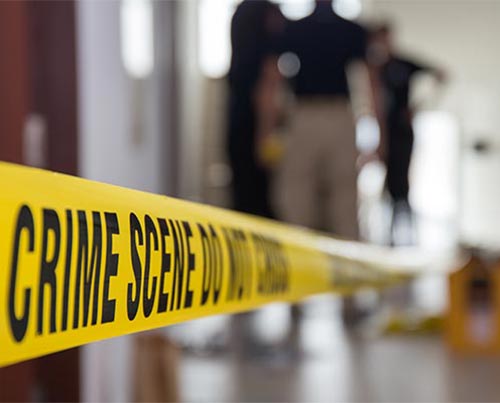 Crime scene tape in a building.