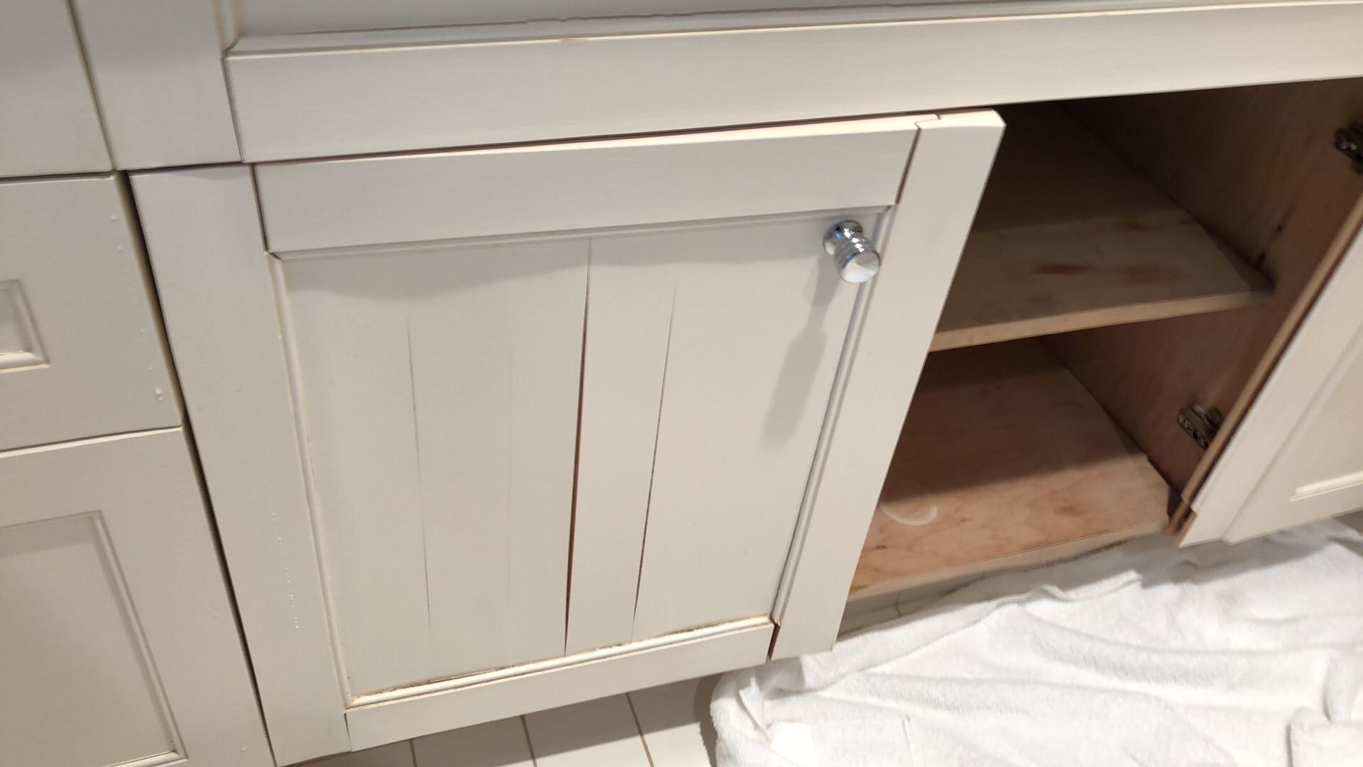 Water damaged bathroom vanity