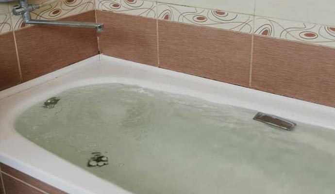 shower and Tub bathtub overflow with water